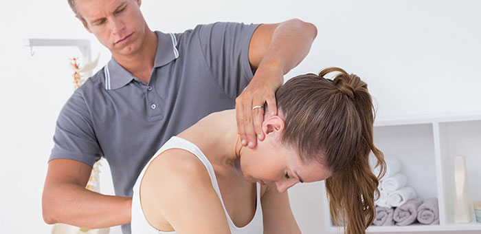 Woman receiving chiropractic adjustment from a Boise chiropractor