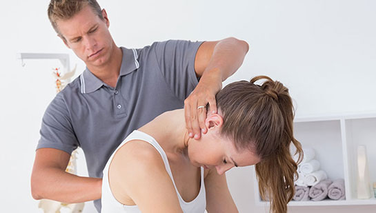 Woman receiving chiropractic adjustment from a Boise chiropractor