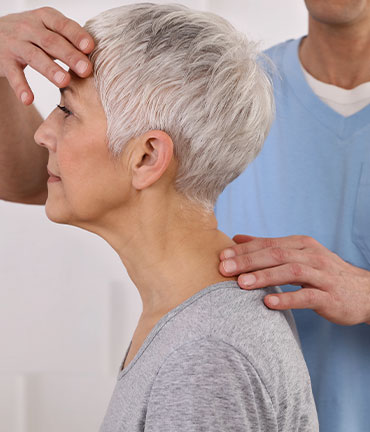 Patient receiving chiropractic adjusmtent for migraine relief from Boise Chiropractors