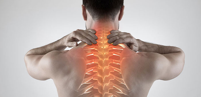 Man with upper back pain before chiropractic treatment from Boise chiropractor