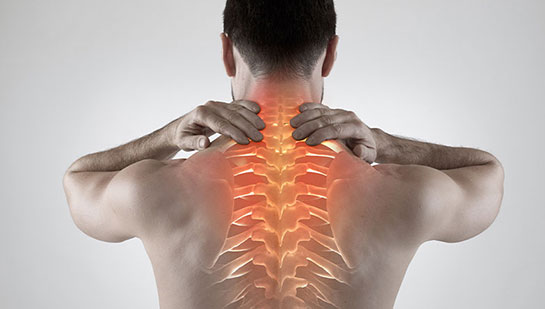 Man with upper back pain before chiropractic treatment from Boise chiropractor